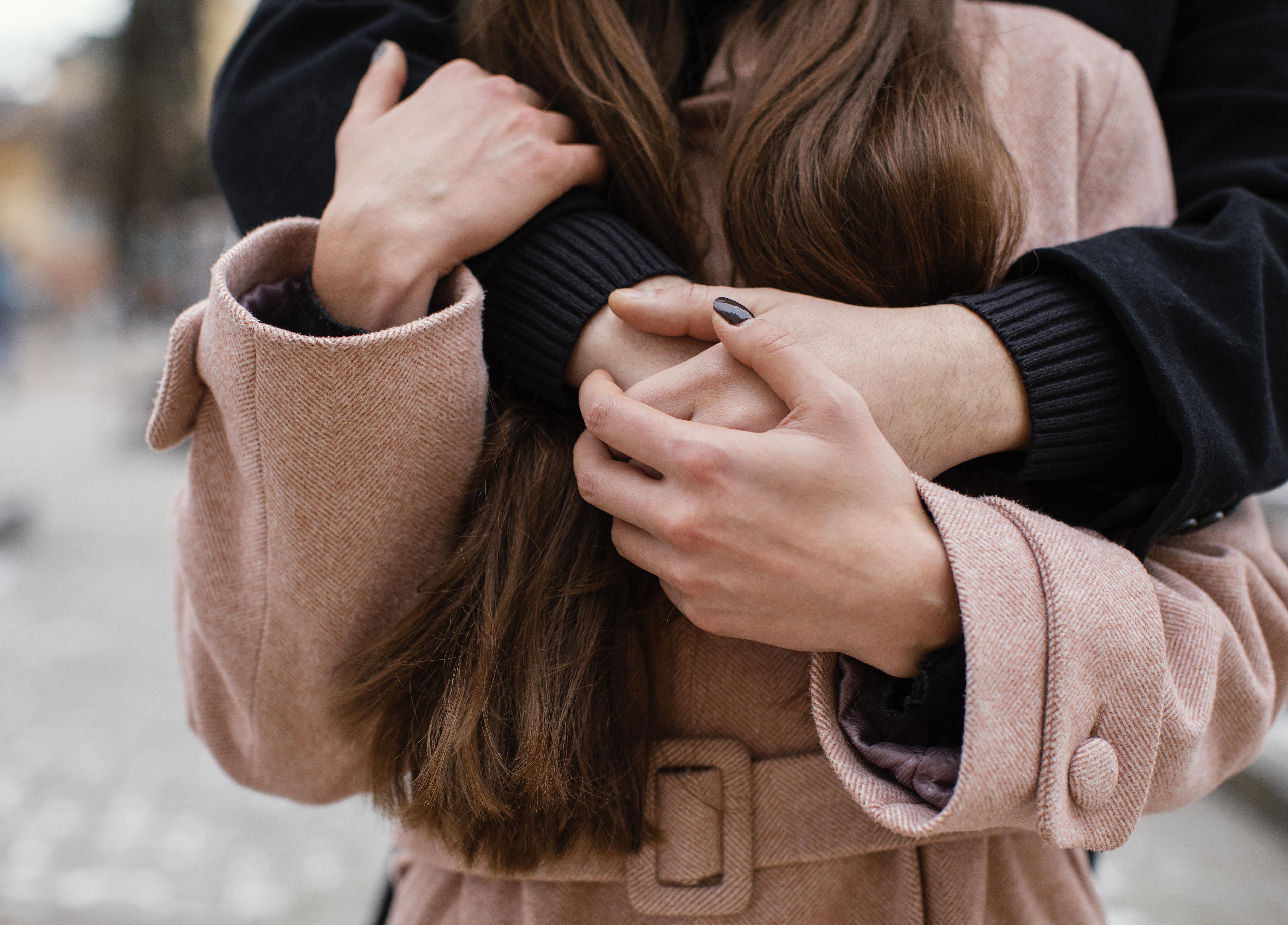 young-couple-hugging-close-up.jpg